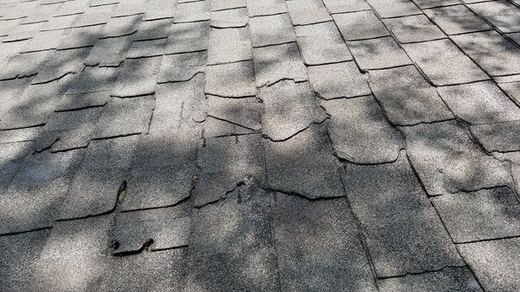 Roof Damage Inspection examining structural decking and flashing in Westfield MA